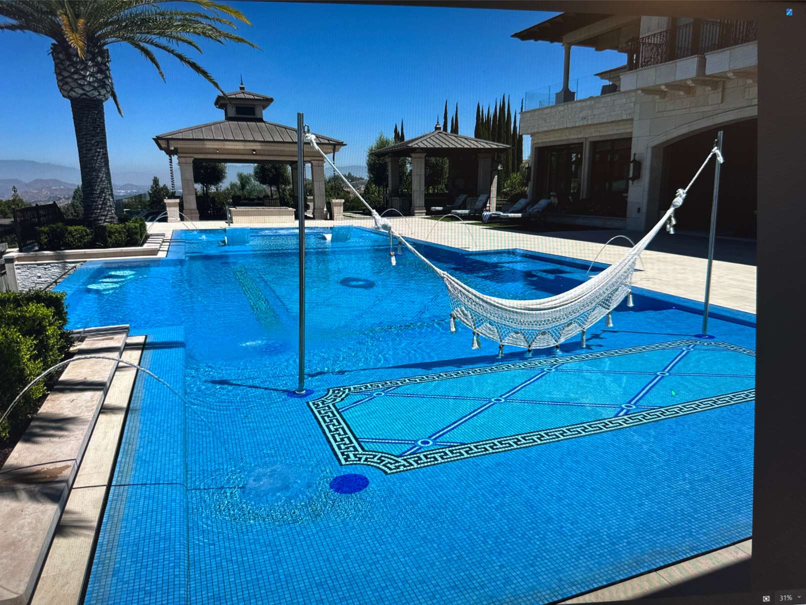 Sunshelf with a hammock next to the pool