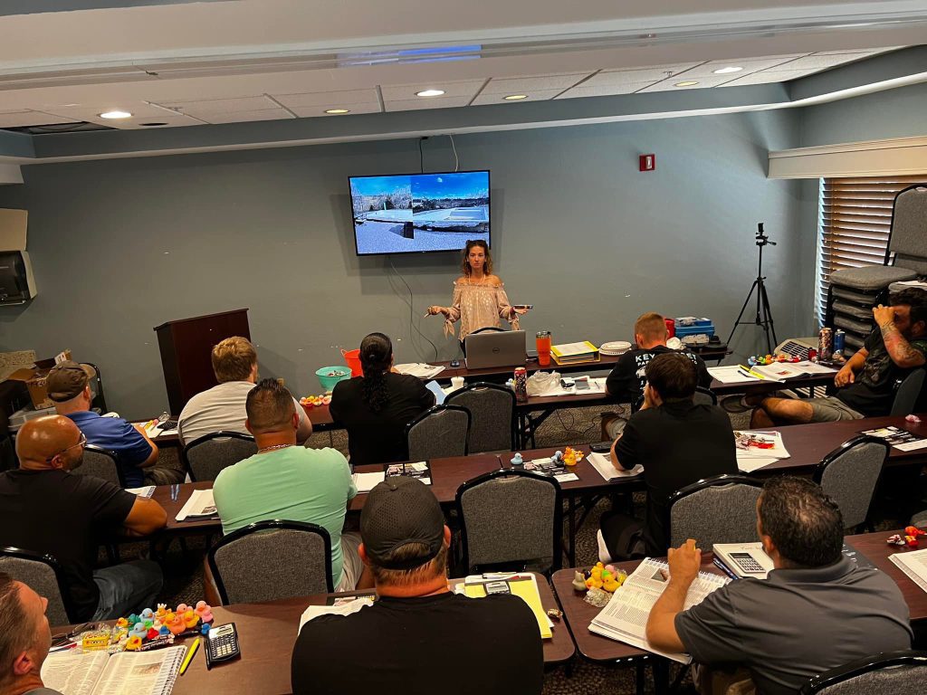 Heather teaching with a class full of students