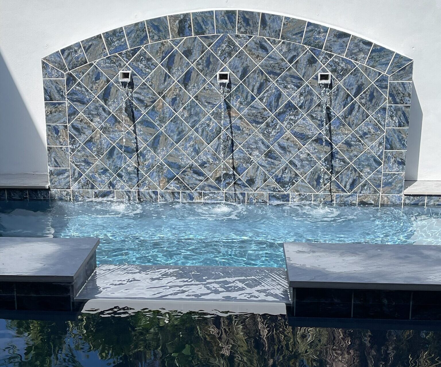 Upgrade your waterline or accents with elegant, long-lasting tile for a custom look, and water feature